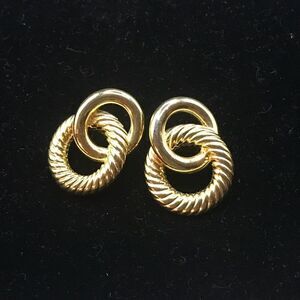 LCI gold tone pierced earrings.